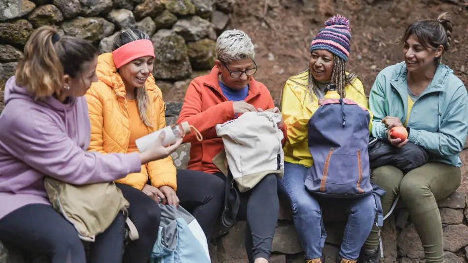 Kind Communication in Teaching Sustainability Multiracial women talk to each other